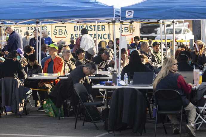 People impacted by wildfires in 2025 seek information and relief at a FEMA Disaster Recovery Center in Pasadena, Calif.